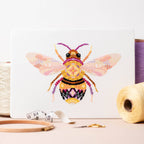 Mandala Bee counted cross stitch kit by Meloca Designs, stitched in pinks and yellows