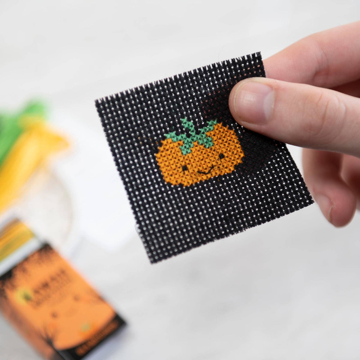 Kawaii Halloween pumpkin cross stitch design on 14 count Aida