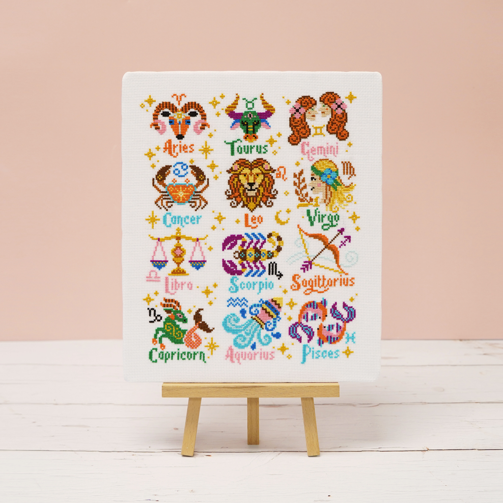 Stellar Signs zodiac cross stitch design showing the twelve star signs on white 14 count aida