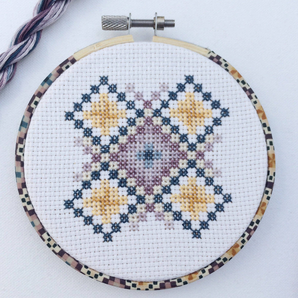 Wooden backing disc that finishes the back of the 4 inch geometric hoop