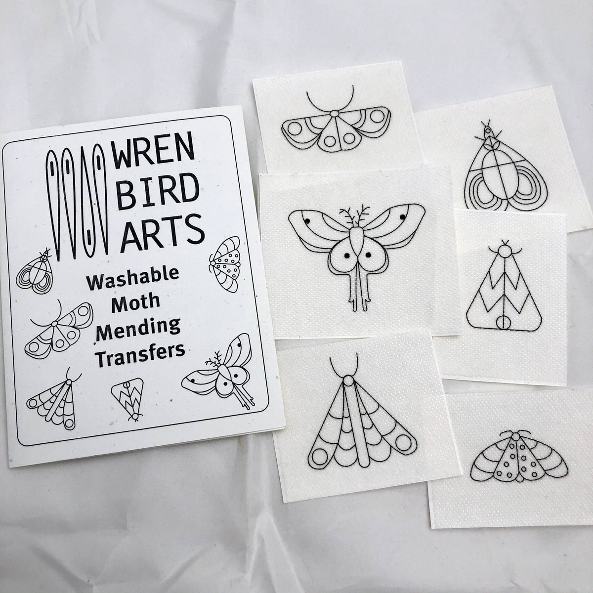 Seven moth designs, sized 1 to 2.5 inches