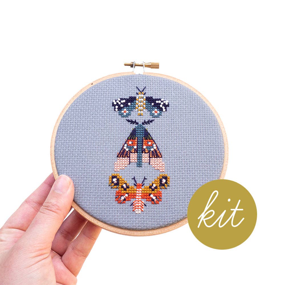 Moths cross stitch kit by Junebug and Darlin, moths stitched in a complex color palette