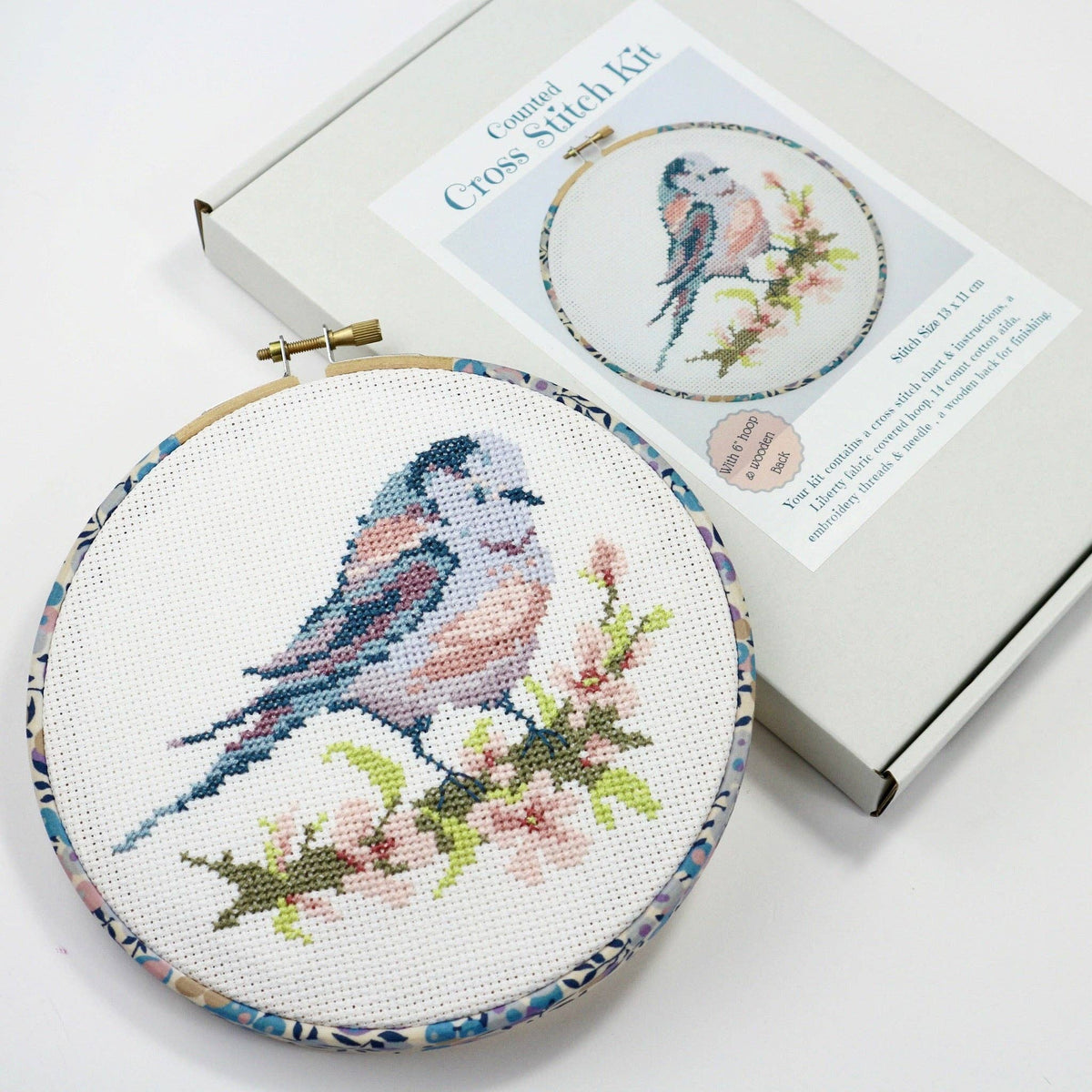 The Liberty Wiltshire Berry Tana Lawn print, blues and lilacs, wrapped around the 6 inch hoop