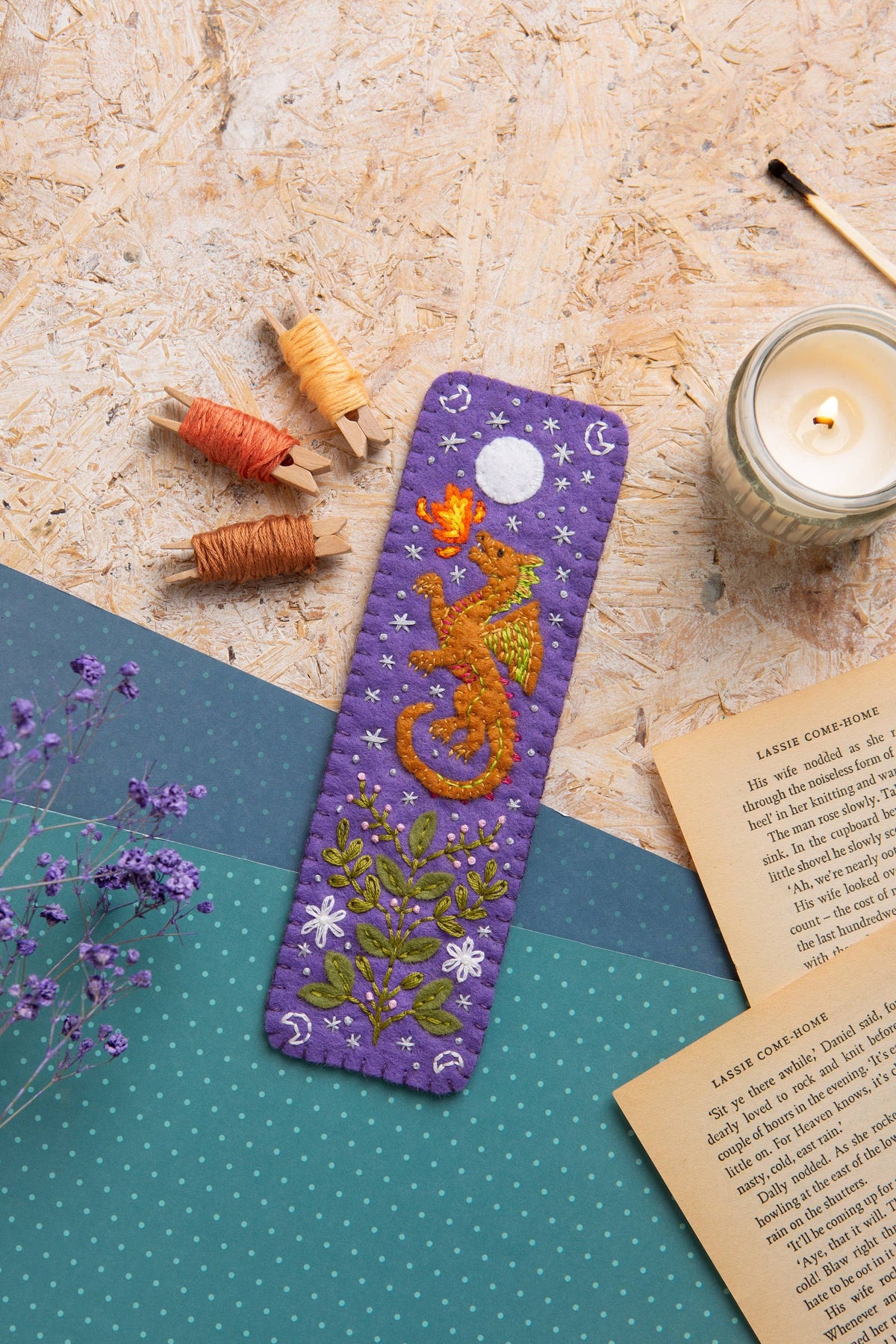 Dragon felt bookmark in use in a book
