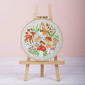 Woodland Whimsies cross stitch design featuring woodland animals on sage green 14 count aida