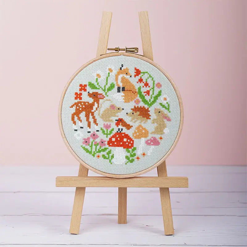 Woodland Whimsies cross stitch design featuring woodland animals on sage green 14 count aida