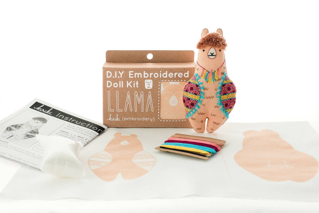 Llama embroidered doll kit contents from Kiriki Press with DMC floss, needle and stuffing