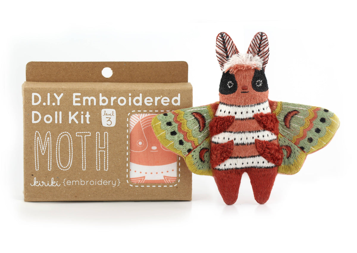 Moth embroidered doll kit contents from Kiriki Press with DMC floss, needle and stuffing