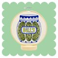 Pickles embroidery design on unbleached cotton in a hoop