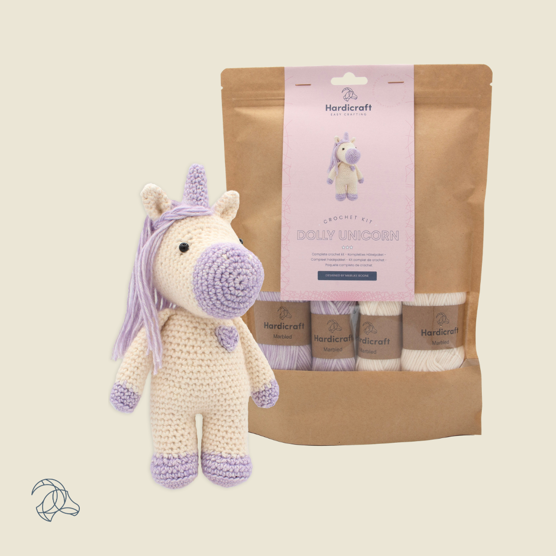 Finished Dolly unicorn amigurumi in white and lilac marbled yarn, 20 cm tall