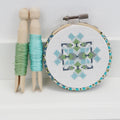 Mini geometric counted cross stitch kit by Stitchkits Crafts in a 3 inch Liberty wrapped hoop, blue and green