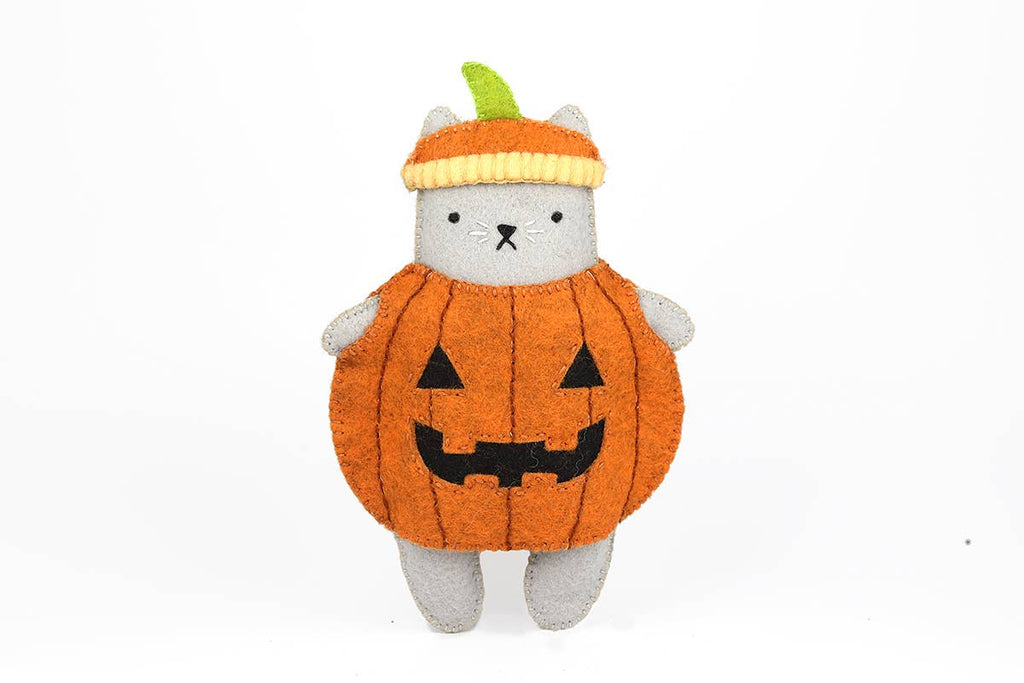 Pumpkin Cat felt doll kit by Kiriki Press, a grey cat in a carved jack-o'-lantern costume
