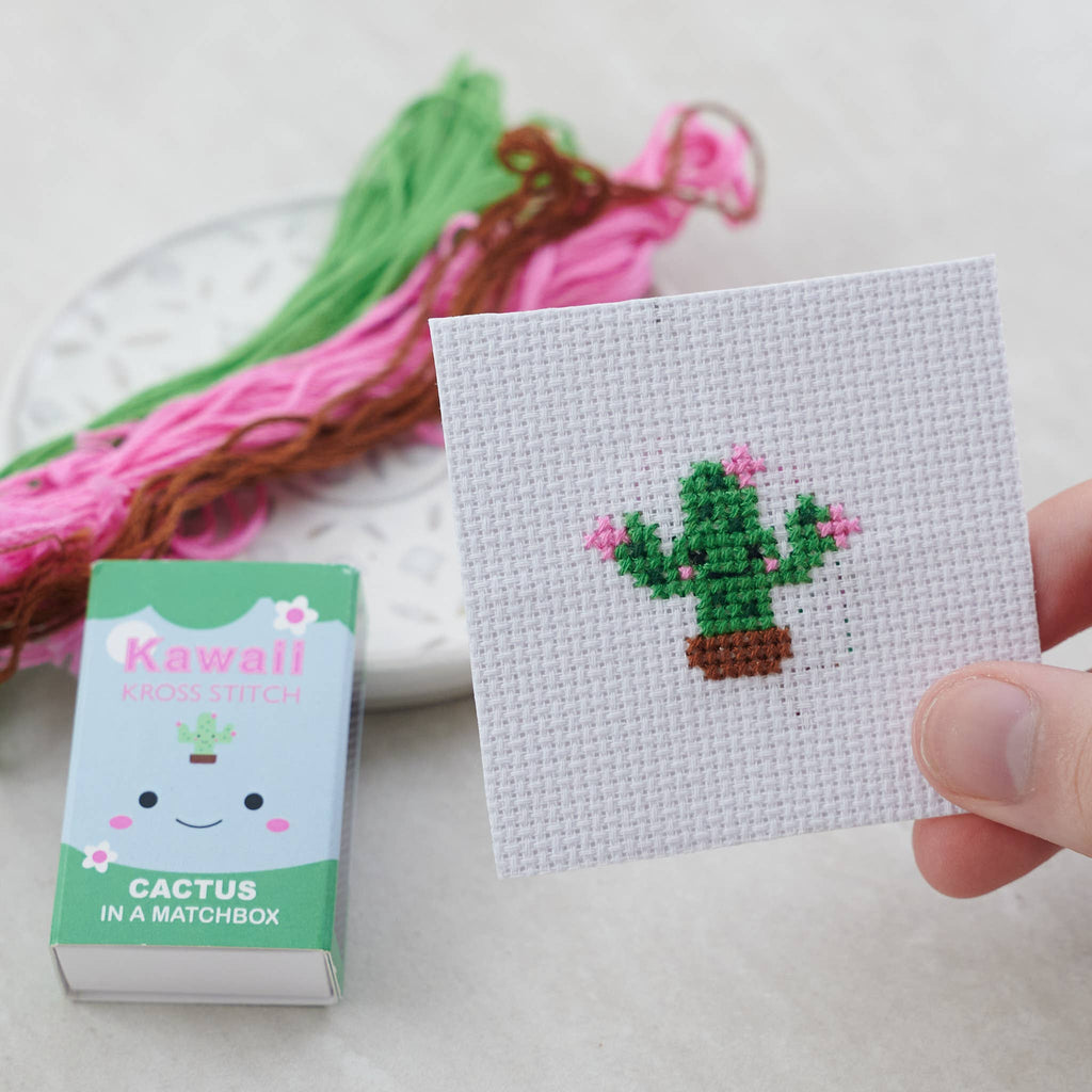 Kawaii flowering cactus cross stitch design on blue 14 count Aida