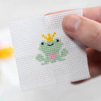 Kawaii frog prince cross stitch design on 14 count Aida