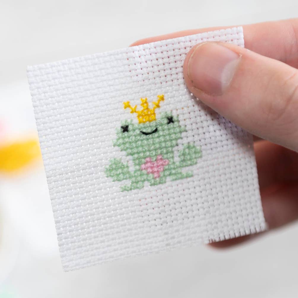 Kawaii frog prince cross stitch design on 14 count Aida