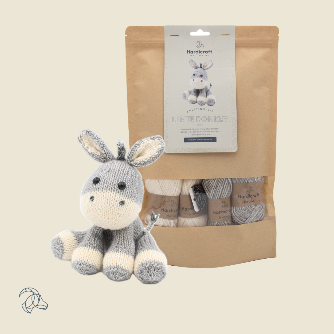 Knitted Lente Donkey amigurumi in white, grey and black marbled yarn