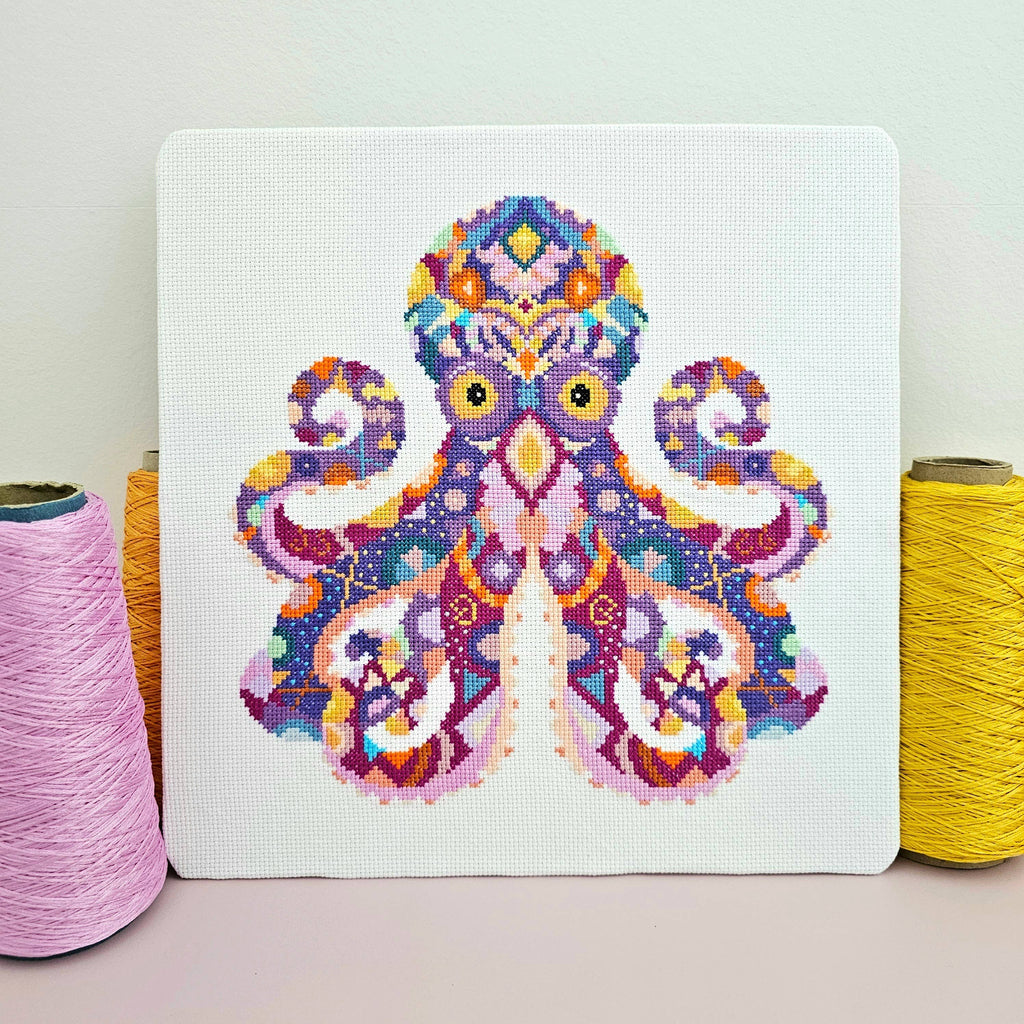 Mandala Octopus cross stitch chart by Meloca Designs, flowing tentacles in rich purples