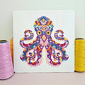 Mandala Octopus cross stitch chart by Meloca Designs, flowing tentacles in rich purples