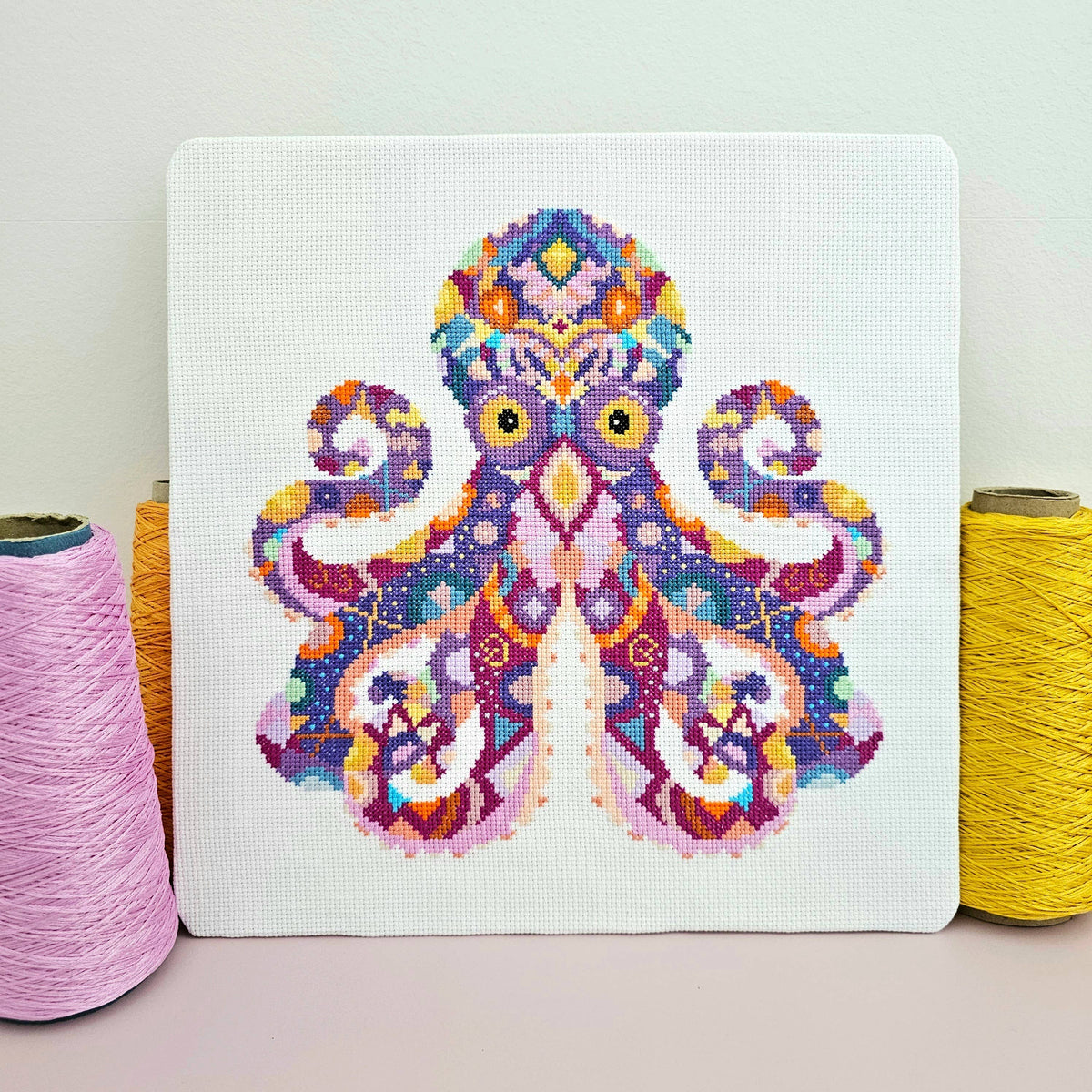 Mandala Octopus cross stitch chart by Meloca Designs, flowing tentacles in rich purples
