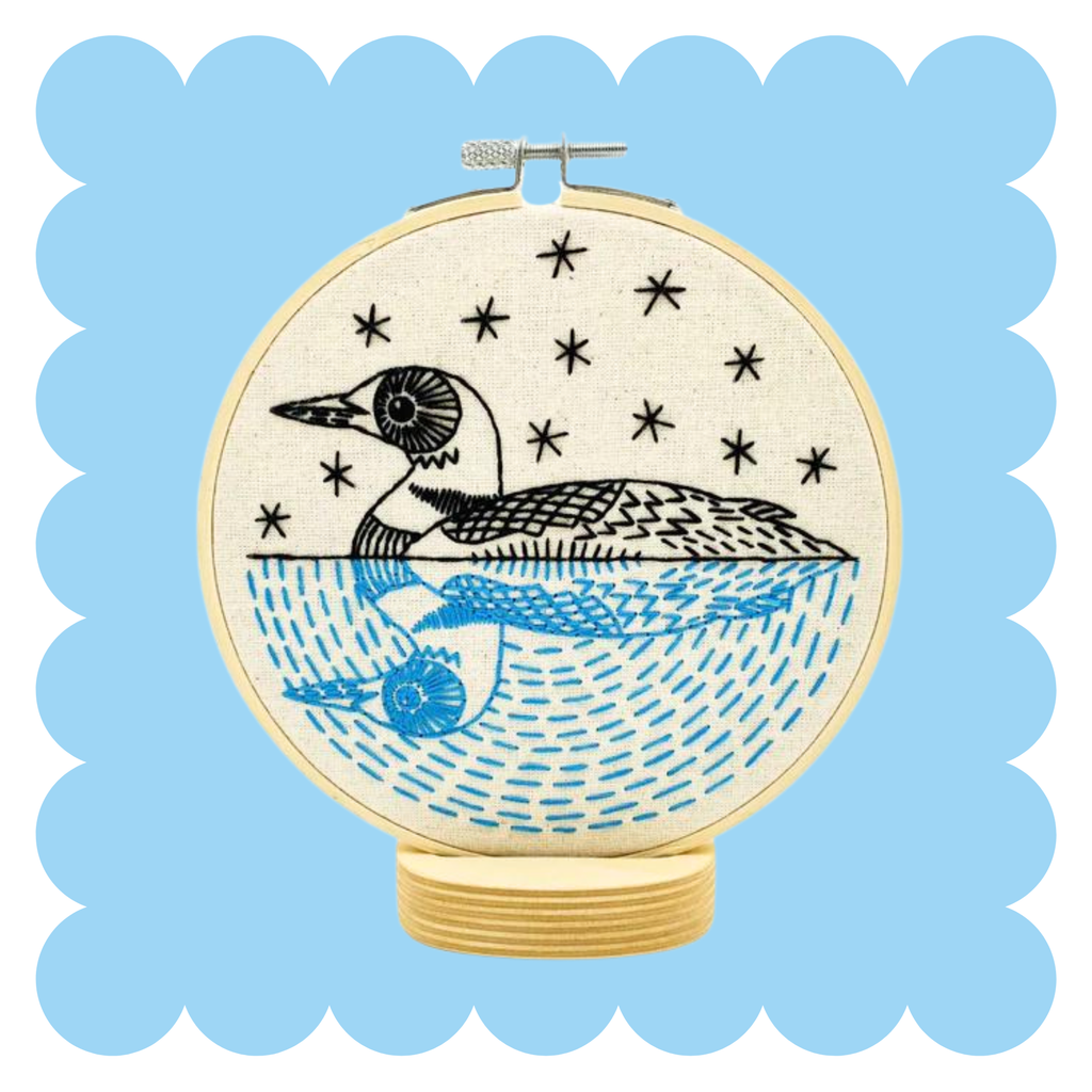 Loon embroidery design on unbleached cotton in a hoop