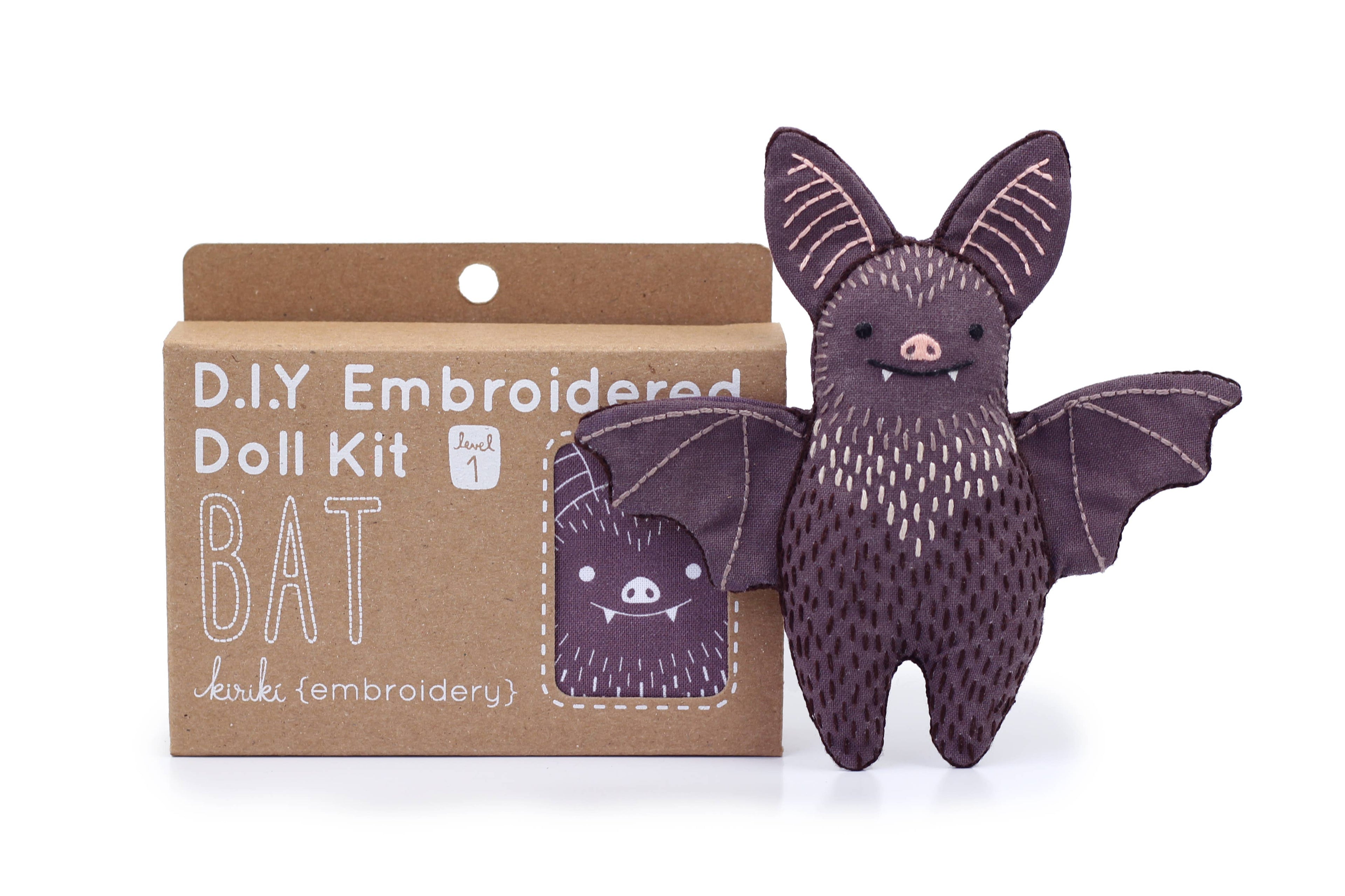 Bat embroidered doll kit contents from Kiriki Press with DMC floss, needle and stuffing