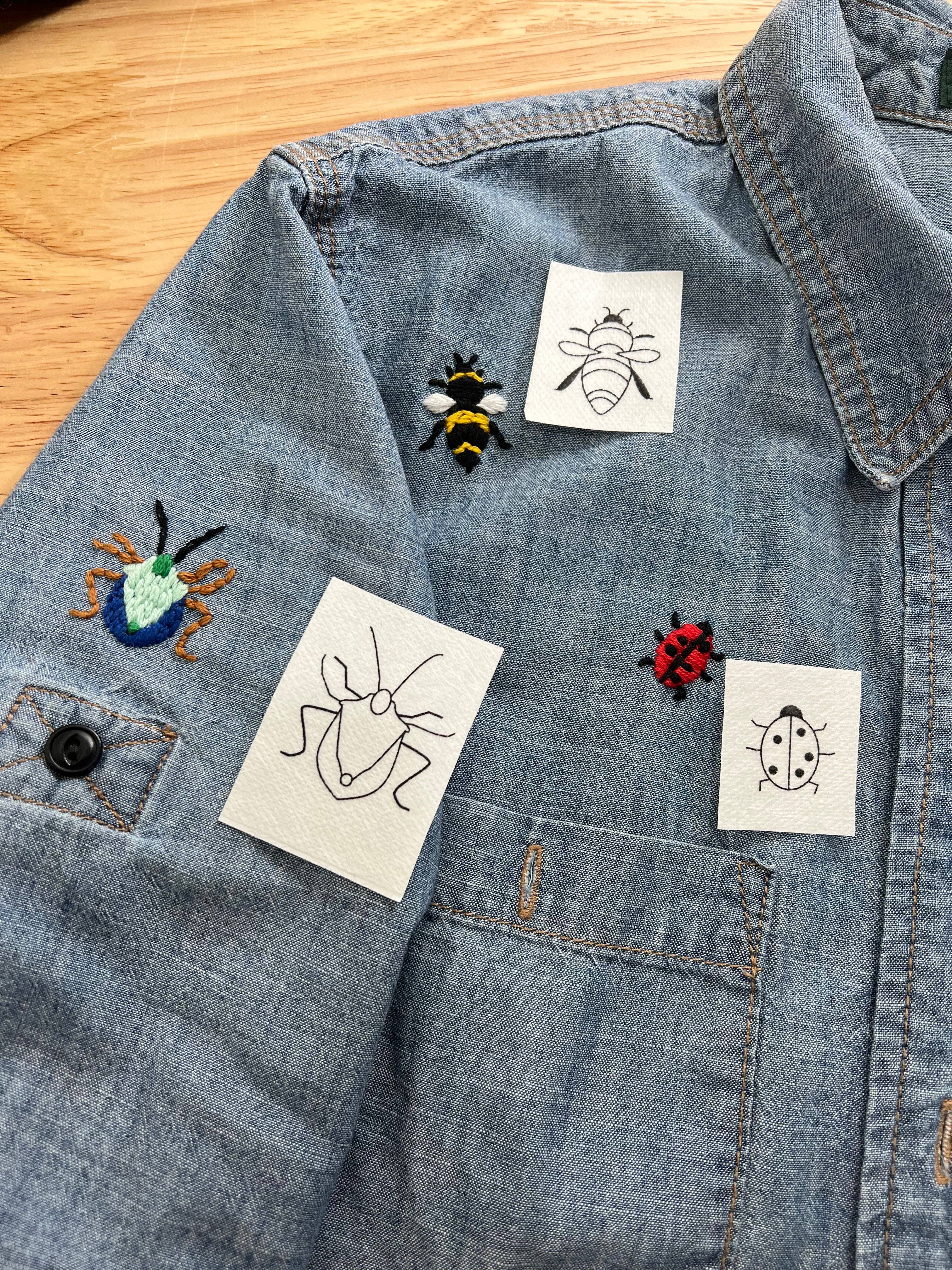 Fifteen insect designs including ants, ladybugs, bees, a butterfly and a spider web