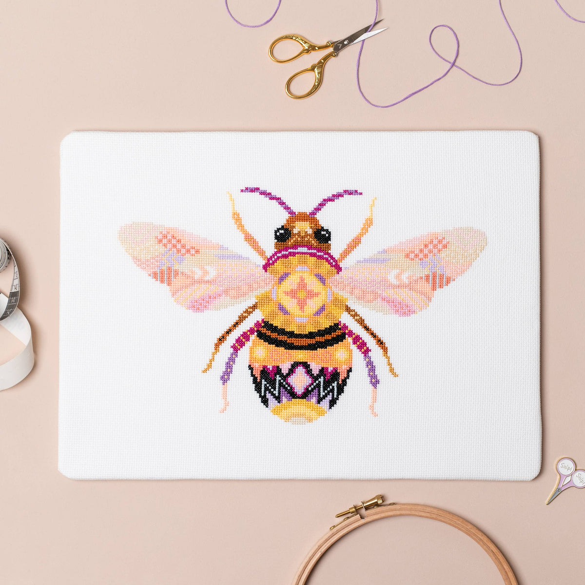 The Mandala Bee design worked on 14 count white aida, 11.3 by 7.2 inches finished