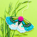 Blue moth felt ornament stitched from wool blend felt with sequins