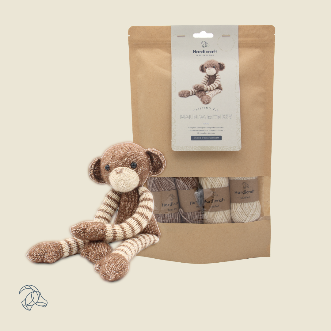 Knitted Malinda Monkey amigurumi in brown and beige marbled yarn