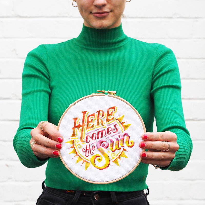 The Here Comes the Sun design worked entirely in full cross stitch, finishing at 5.4 by 5.3 inches