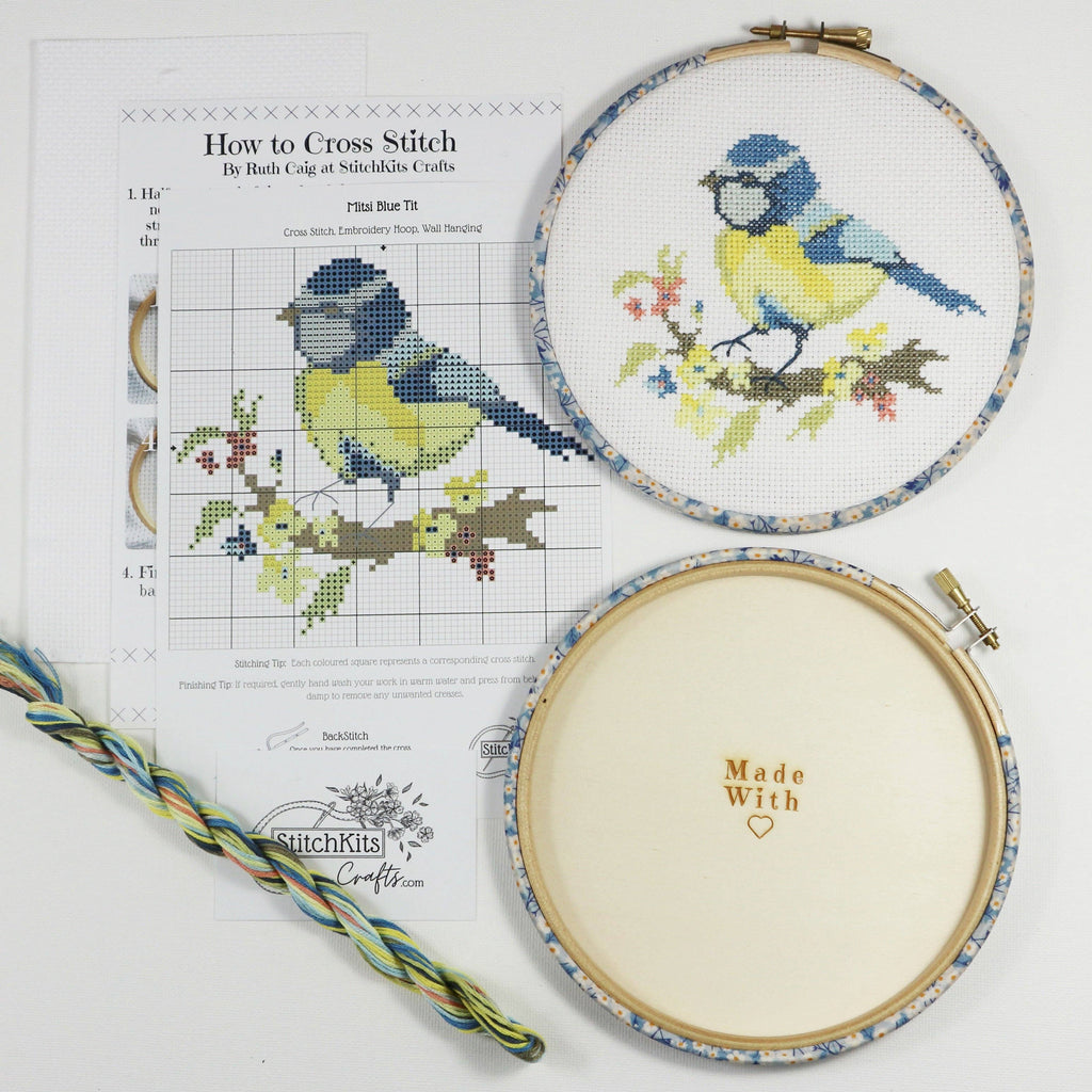 Blue Tit cross stitch kit packaging, listing the chart, aida, threads, needle and wooden back