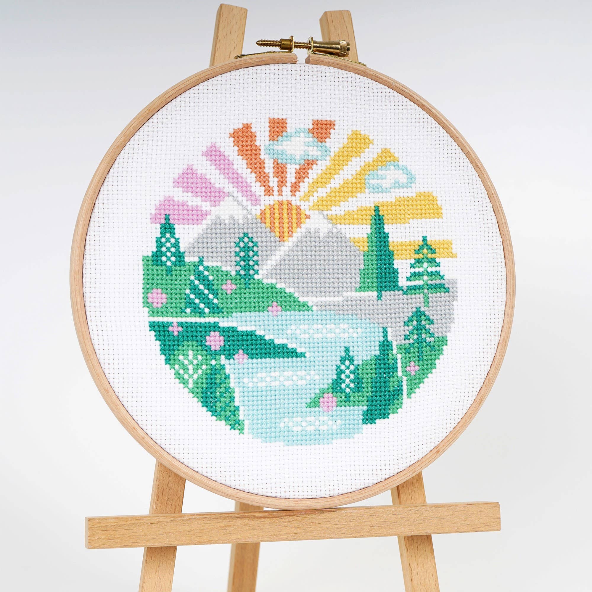 Wandering Peaks mountain landscape cross stitch design in bright flat color on white 14 count aida