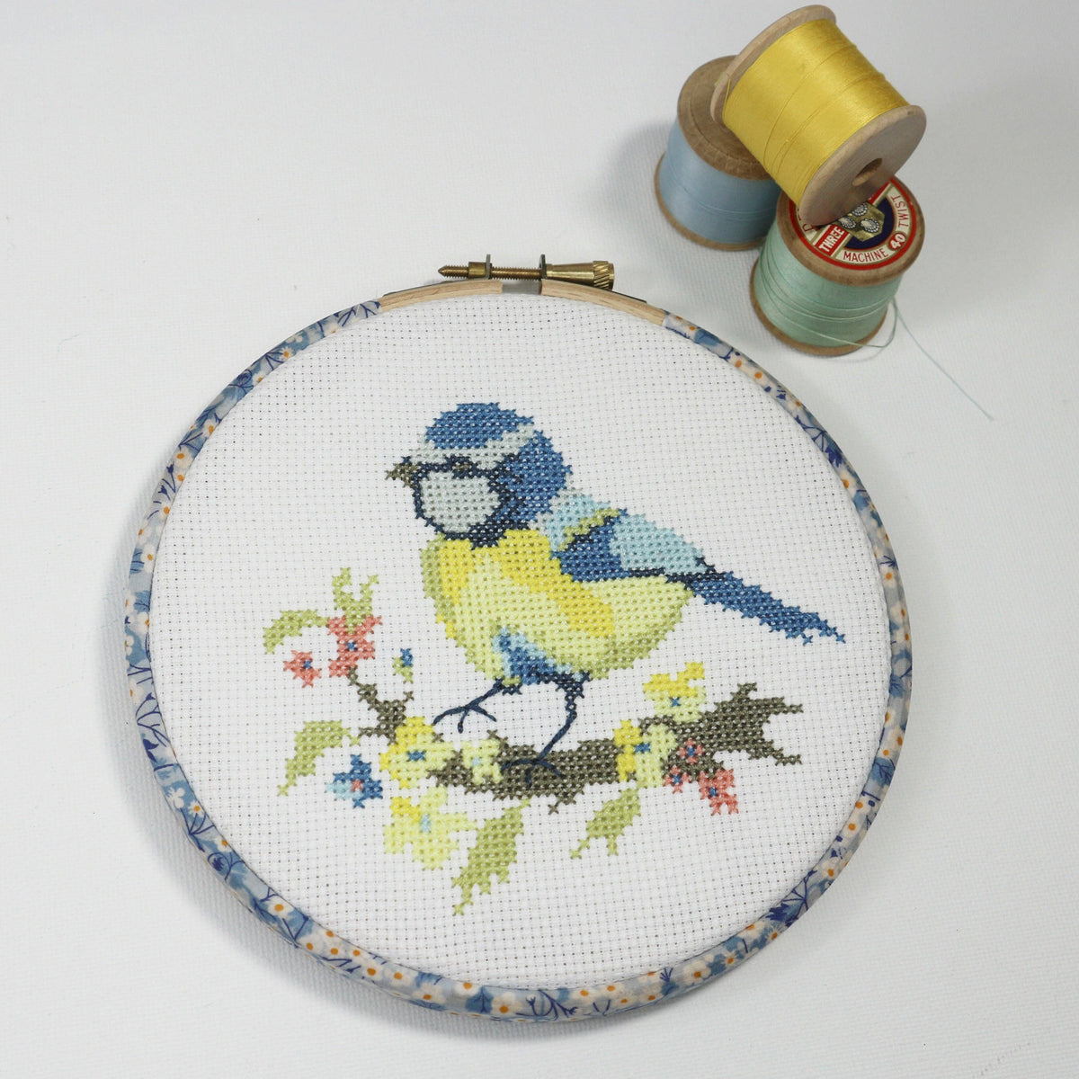 Blue Tit counted cross stitch kit by Stitchkits Crafts, finished in a Liberty wrapped 6 inch hoop