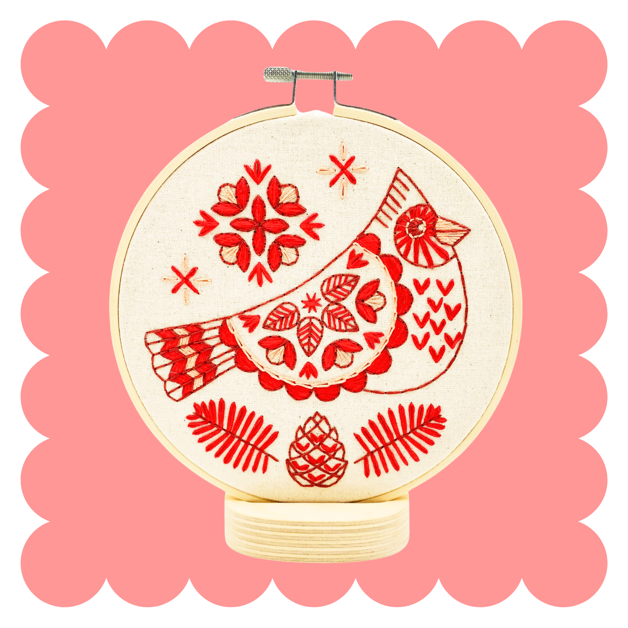 Cardinal embroidery design in three tonal colours on unbleached cotton