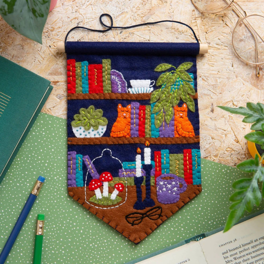 Finished Book Lover felt pennant on its wooden dowel