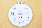 Beginner embroidery stitch sampler pack from Kiriki Press with DMC floss and a no. 9 needle