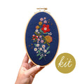 Forget-Me-Knots cross stitch kit by Junebug and Darlin, a floral bouquet in bright thread on navy cloth