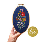 Forget-Me-Knots cross stitch kit by Junebug and Darlin, a floral bouquet in bright thread on navy cloth