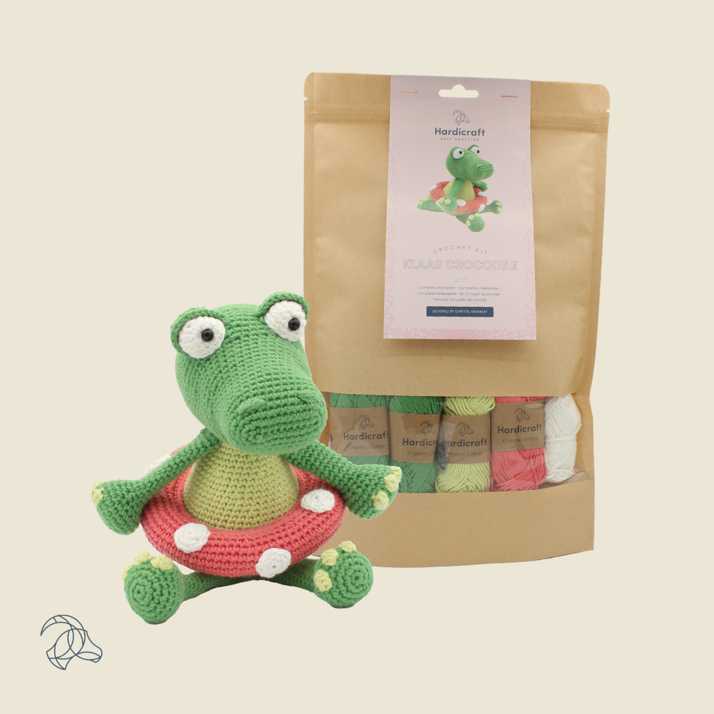 Finished Klaas crocodile amigurumi in green, red and white organic cotton, 22 cm