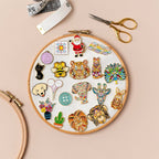 Mandala Alpaca needle minder on its Meloca Designs backing card, 2.5 by 4 cm