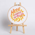 Here Comes the Sun cross stitch design, a bright summer scene stitched in DMC cotton on white 14 count aida