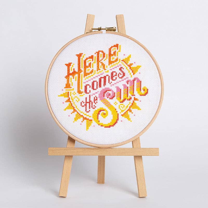 Here Comes the Sun cross stitch design, a bright summer scene stitched in DMC cotton on white 14 count aida