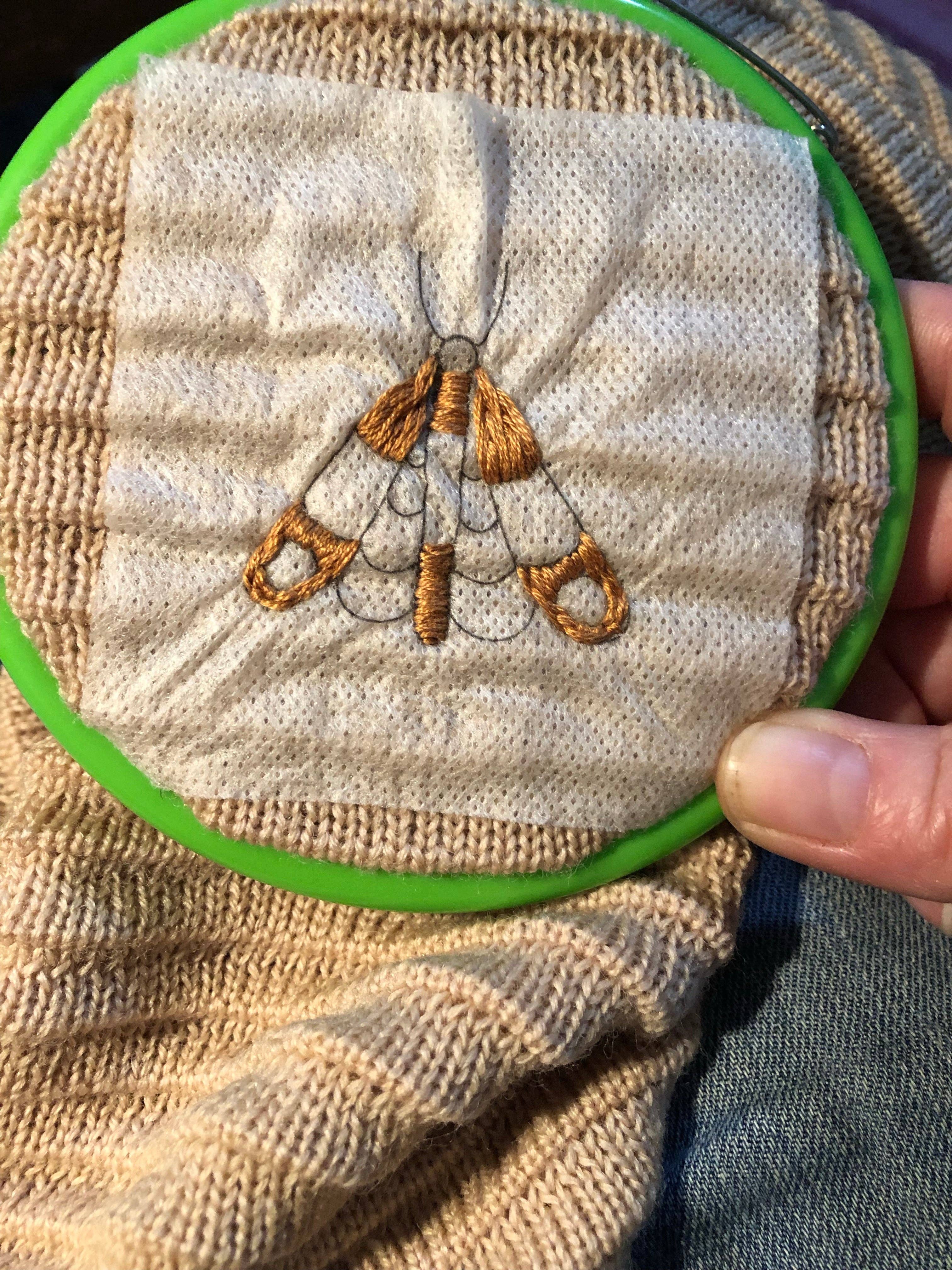 Stick the transfer on, embroider through it, rinse it away in the sink