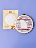 State Silhouette embroidery pattern package next to stitched Georgia sampler in a hoop
