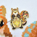 Mandala Squirrel magnetic needle minder by Meloca Designs, squirrel artwork in orange and brown