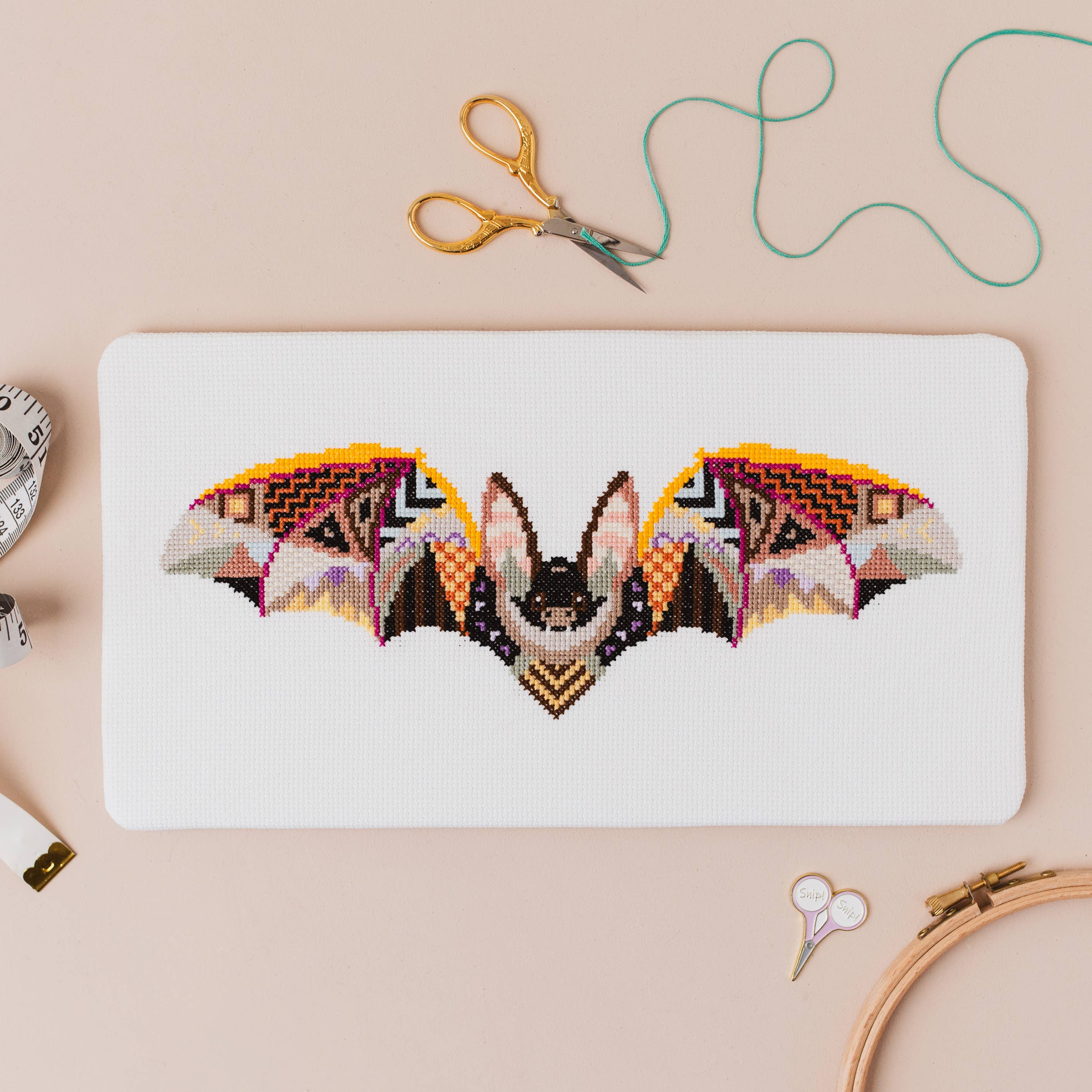 The Mandala Bat design worked on 14 count white aida, 11.4 by 4 inches finished