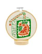 Orange Juice Box embroidery kit contents including hoop, floss and needle
