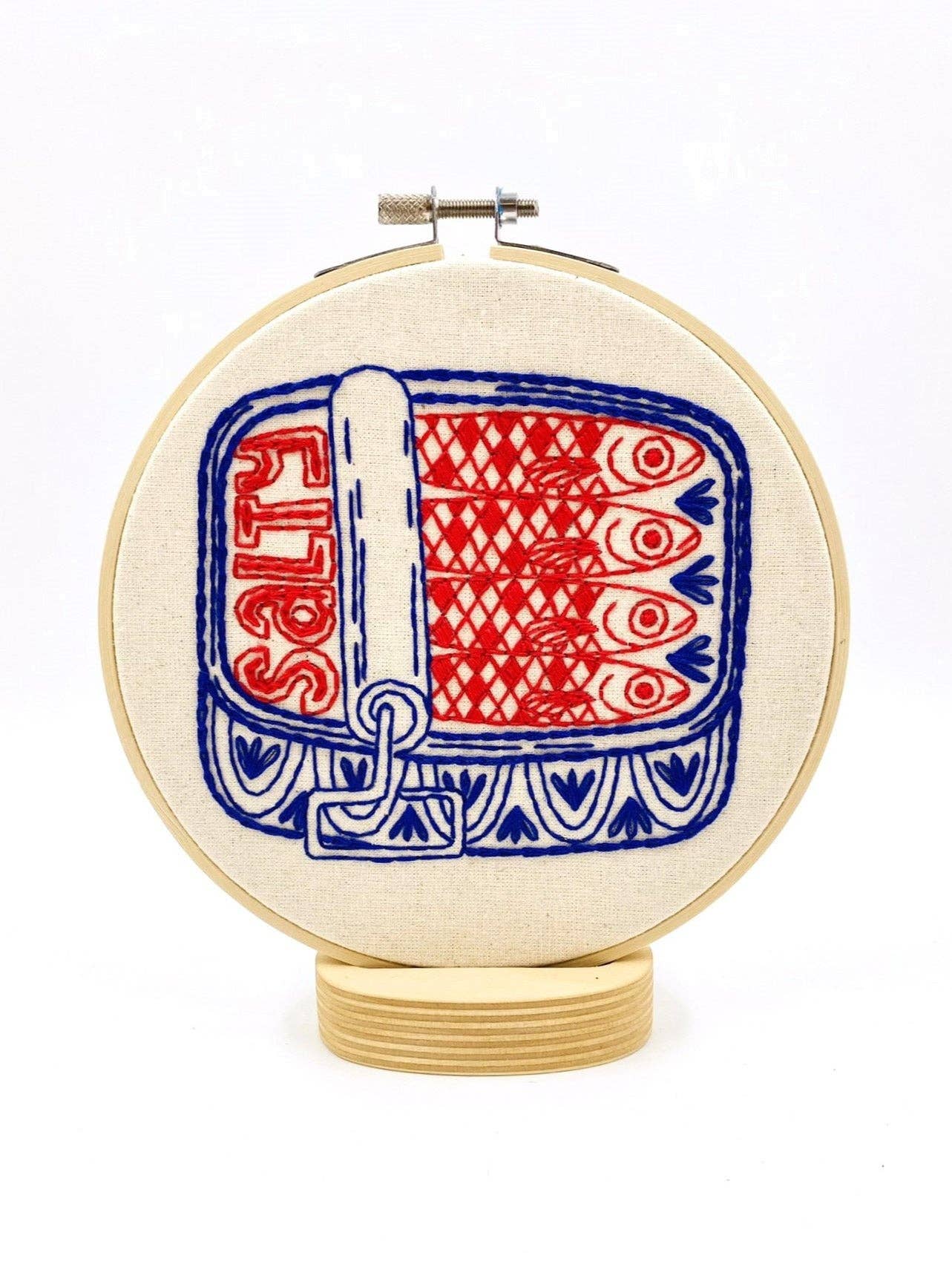 Sardines embroidery kit contents including hoop, floss and needle