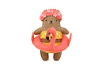 Flamingo Cat felt doll kit by Kiriki Press, a brown cat in a floral swim cap and flamingo pool float