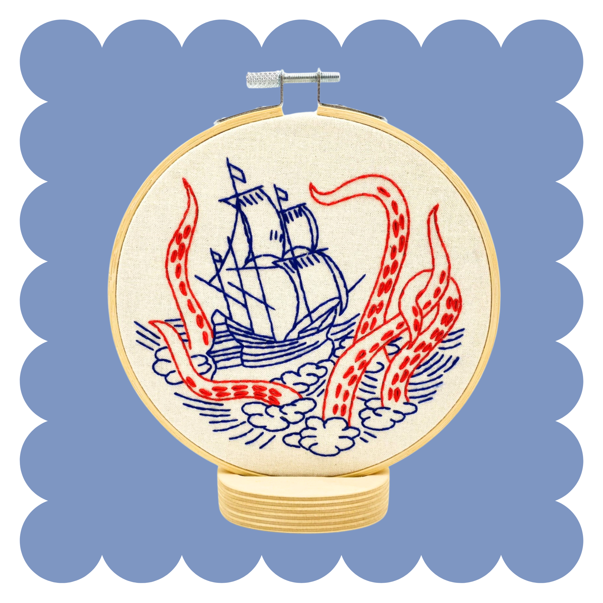 Kraken and Ship embroidery design on unbleached cotton in a hoop